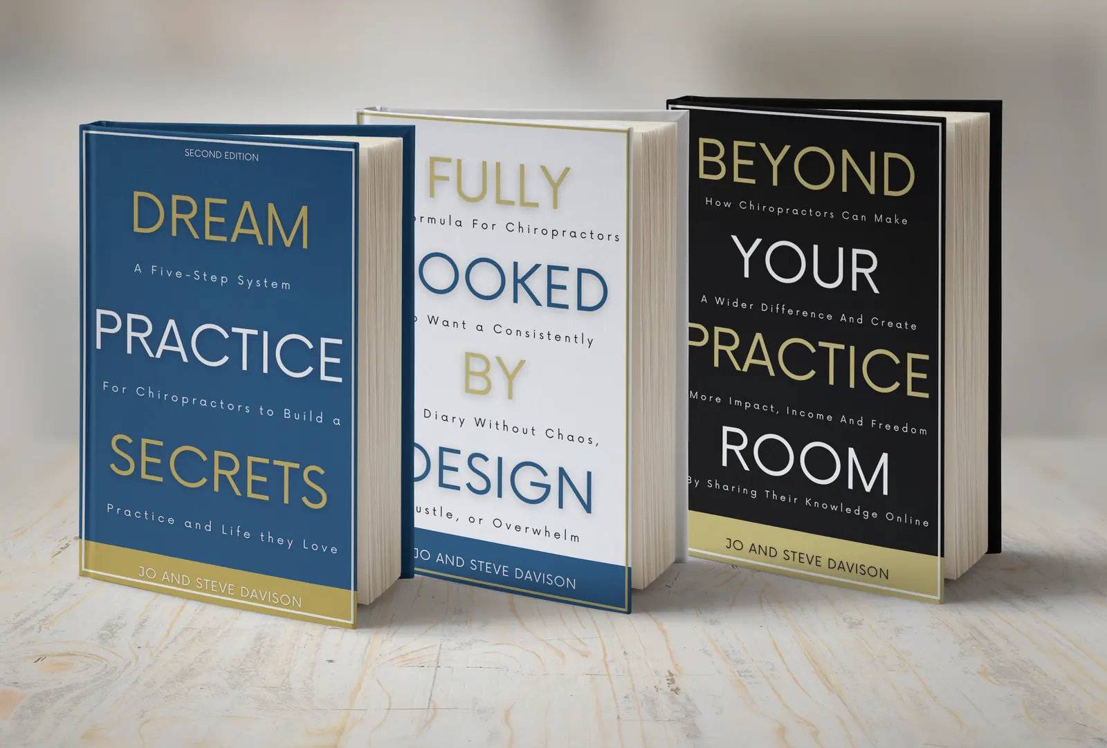 The trilogy by Jo and Steve Davison standing on a wooden table: Dream Practice Secrets, second edition, in blue; Fully Booked by Design in white; and Beyond Your Practice Room in black.
