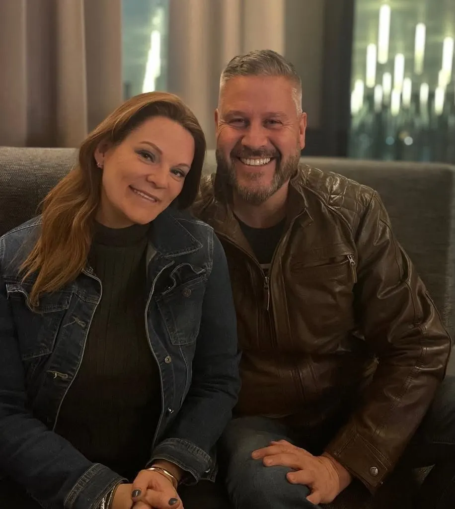 Jo Davison, left, with her husband and business partner Steve Davison, both smiling.